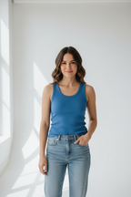 Woman wearing a blue tank top on a white background